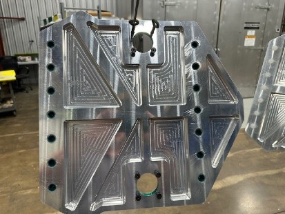 metal fabrication large silver component at falk precision inc machine shop